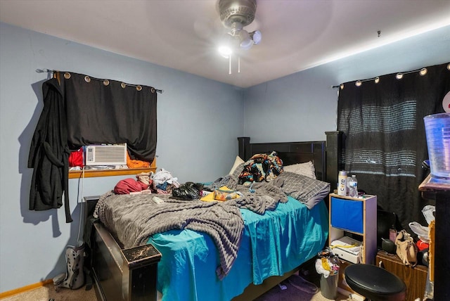 carpeted bedroom featuring cooling unit and ceiling fan