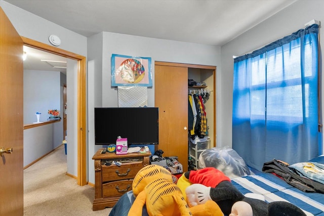 carpeted bedroom with a closet