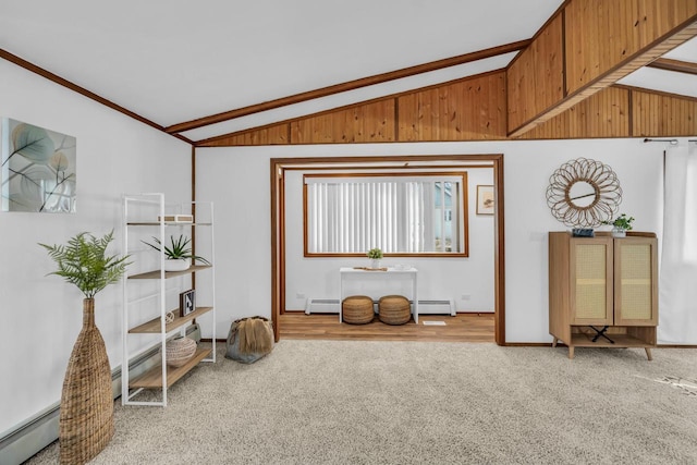 sitting room featuring a baseboard heating unit, carpet floors, and vaulted ceiling