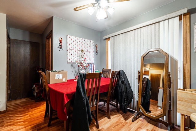 dining area featuring hardwood / wood-style flooring and ceiling fan