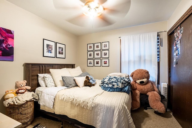 carpeted bedroom featuring ceiling fan