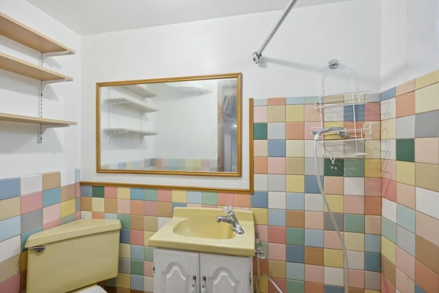 bathroom with toilet and vanity