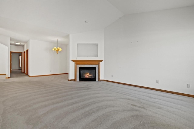 unfurnished living room with light carpet, vaulted ceiling, a tiled fireplace, and a notable chandelier