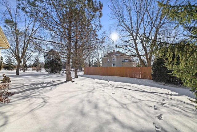 view of yard covered in snow