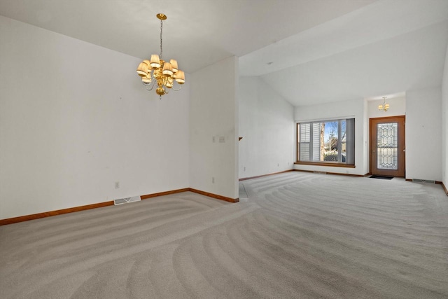 unfurnished living room with light carpet, lofted ceiling, and a notable chandelier