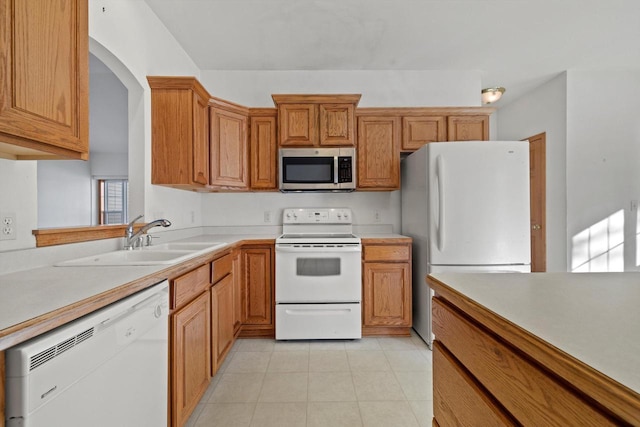 kitchen featuring sink and white appliances