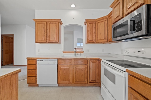 kitchen featuring sink and white appliances