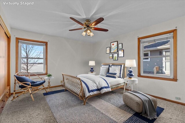 N4621 Lake Dr, Hustisford, WI 53034 - bedroom featuring ceiling fan, a closet, and carpet flooring
