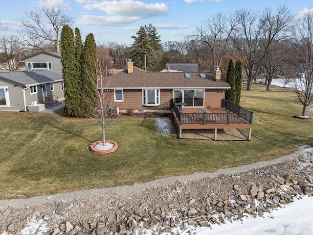 N4621 Lake Dr, Hustisford, WI 53034 - back of property with a deck and a lawn