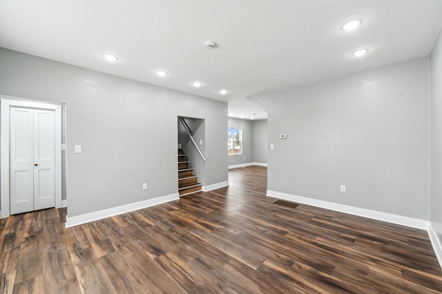 empty room with dark hardwood / wood-style floors