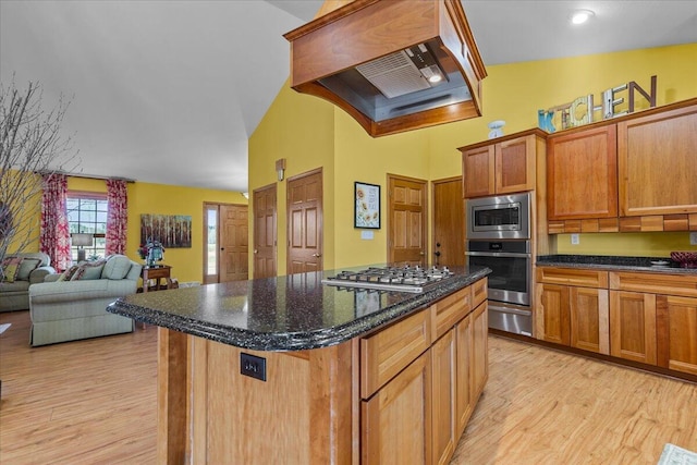 kitchen featuring light hardwood / wood-style flooring, appliances with stainless steel finishes, a kitchen island, and custom range hood