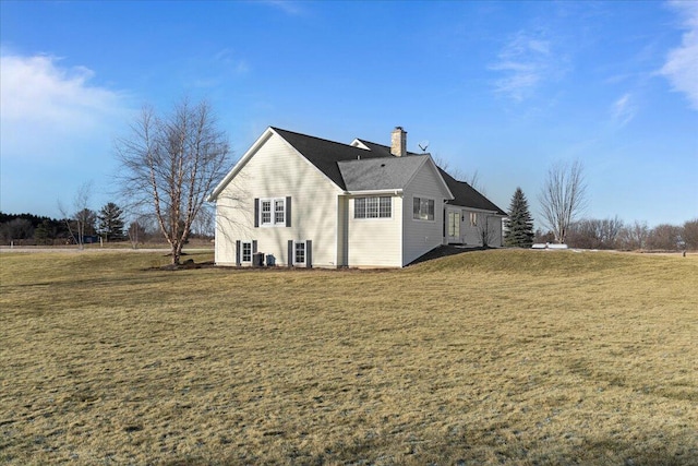 view of property exterior featuring a lawn