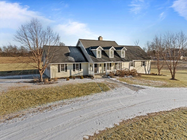 new england style home featuring covered porch