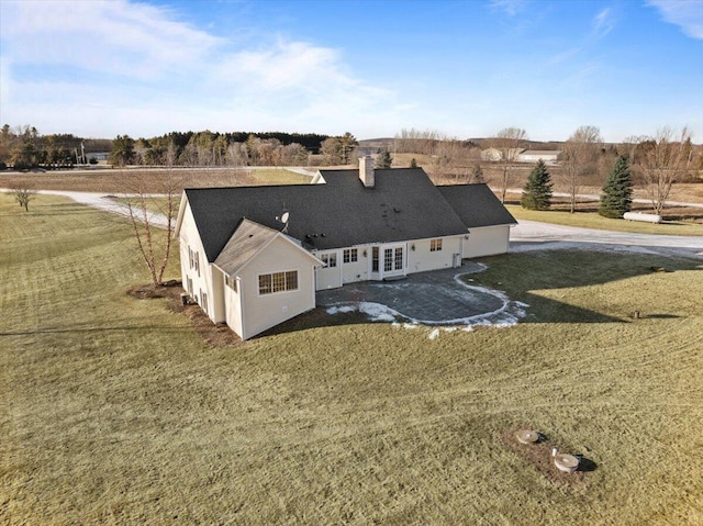 birds eye view of property featuring a rural view