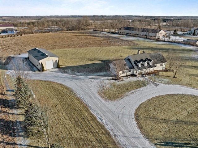 birds eye view of property with a rural view