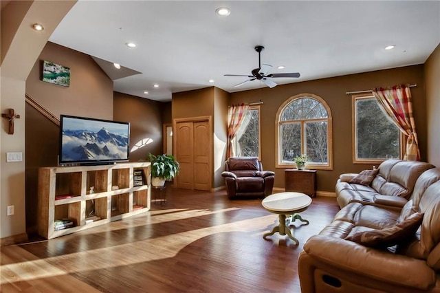 living room with ceiling fan and hardwood / wood-style flooring