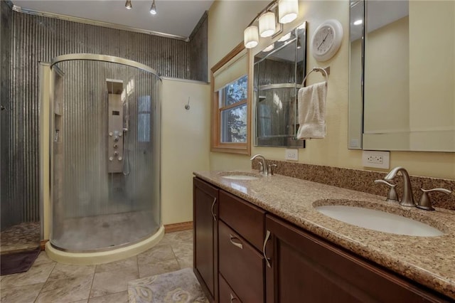 bathroom with vanity, crown molding, and an enclosed shower