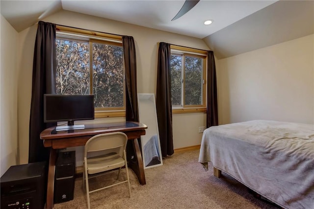 bedroom featuring ceiling fan, multiple windows, carpet, and vaulted ceiling