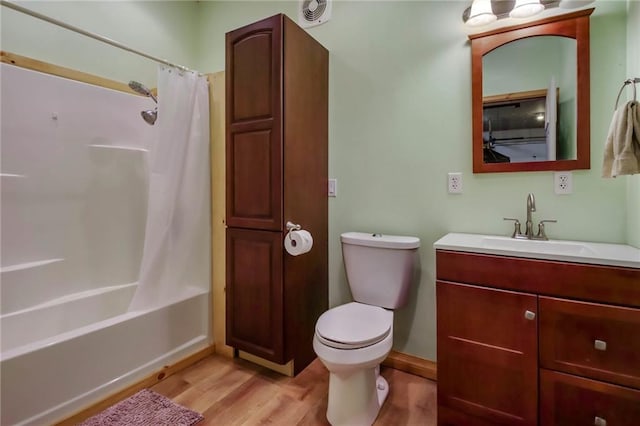 full bathroom with toilet, vanity, shower / bath combo, and hardwood / wood-style floors