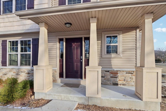 doorway to property featuring a porch