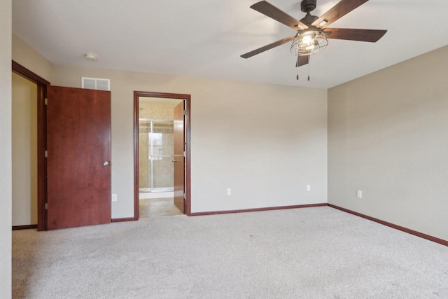 carpeted empty room with ceiling fan