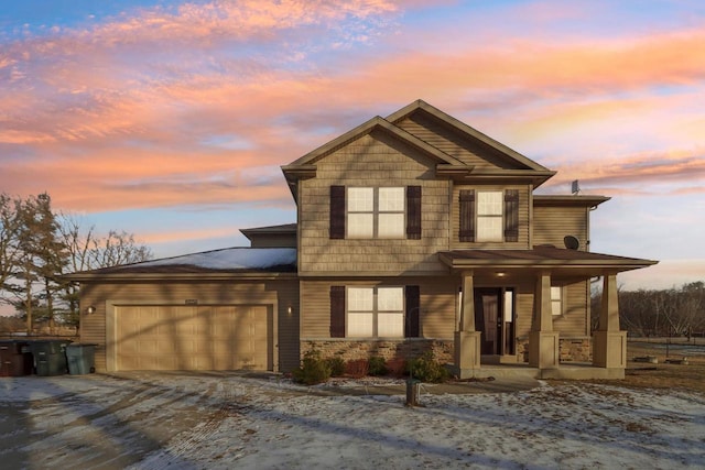 view of front of home with a garage and a porch