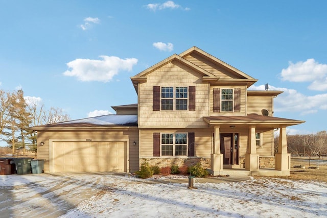 view of front of home featuring a garage and covered porch