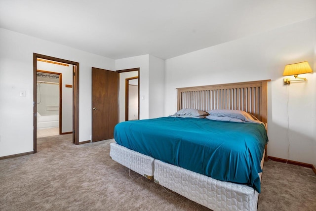 bedroom featuring carpet flooring and connected bathroom