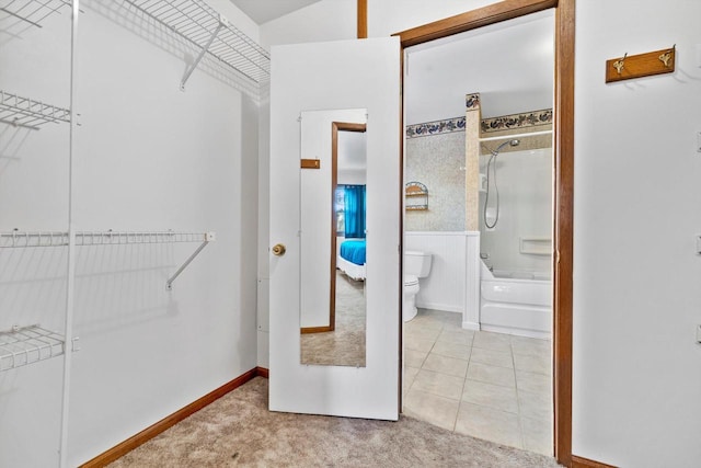 spacious closet featuring light tile patterned floors