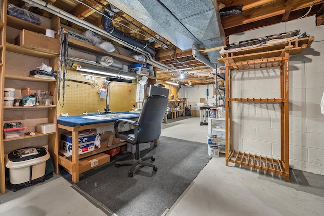 office area with concrete flooring and a workshop area