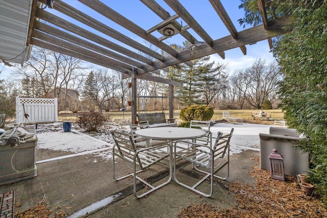 view of patio with a pergola and a rural view