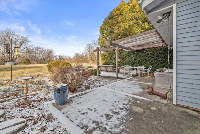 yard covered in snow featuring a patio area and a pergola