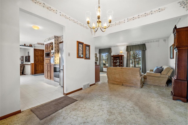 interior space featuring light carpet and an inviting chandelier