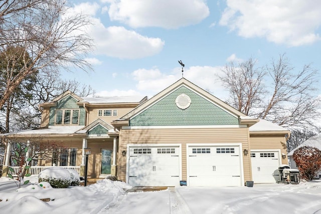 view of front facade with a garage and a porch