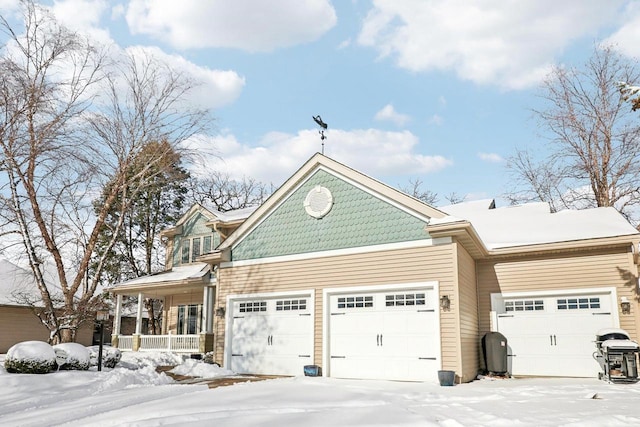 view of front facade with covered porch and a garage