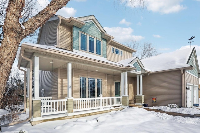 craftsman-style house with covered porch and a garage