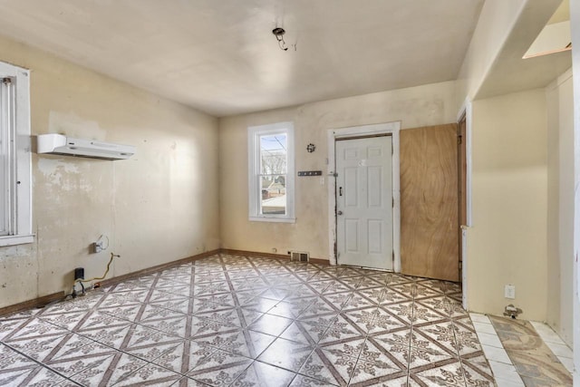 entrance foyer with an AC wall unit