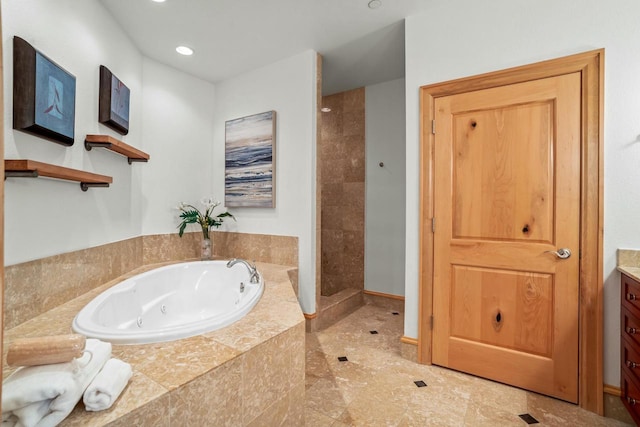 bathroom featuring separate shower and tub and vanity