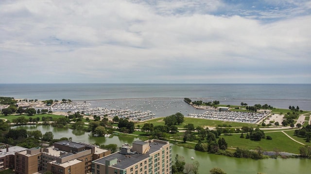 birds eye view of property with a water view