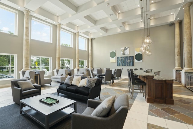 interior space featuring a high ceiling and ornate columns