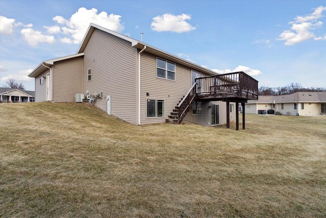 back of house with a yard, a wooden deck, and cooling unit