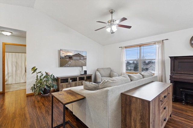 living room featuring ceiling fan, dark hardwood / wood-style flooring, and lofted ceiling