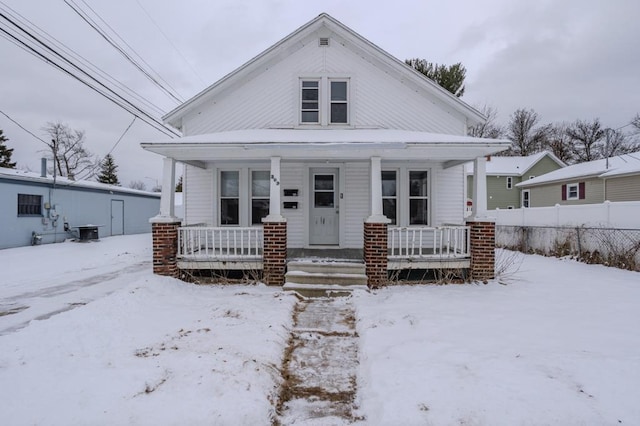 bungalow featuring covered porch and central AC