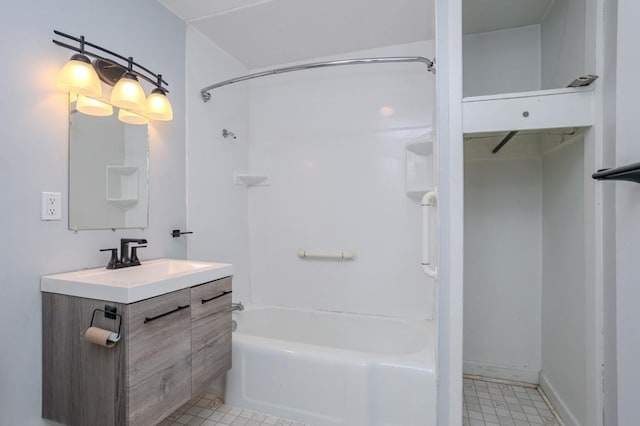 bathroom with vanity and tub / shower combination