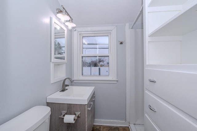 bathroom featuring toilet and vanity