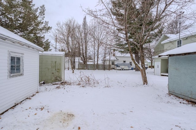 view of yard layered in snow