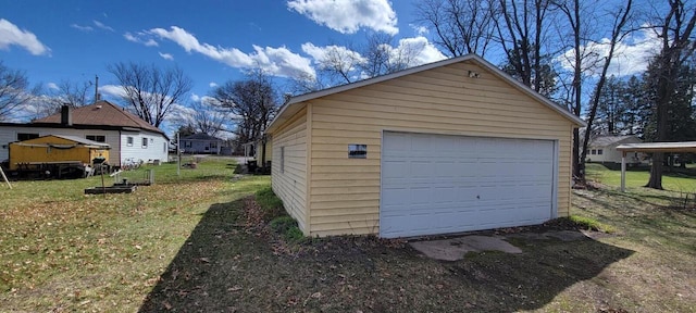 garage featuring a yard