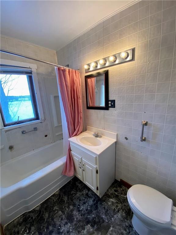 full bathroom with toilet, vanity, tile walls, and shower / bath combination with curtain