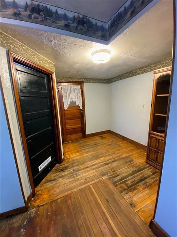 spare room featuring hardwood / wood-style flooring