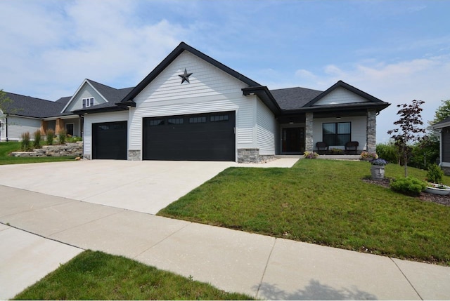 view of front of property featuring a garage and a front yard